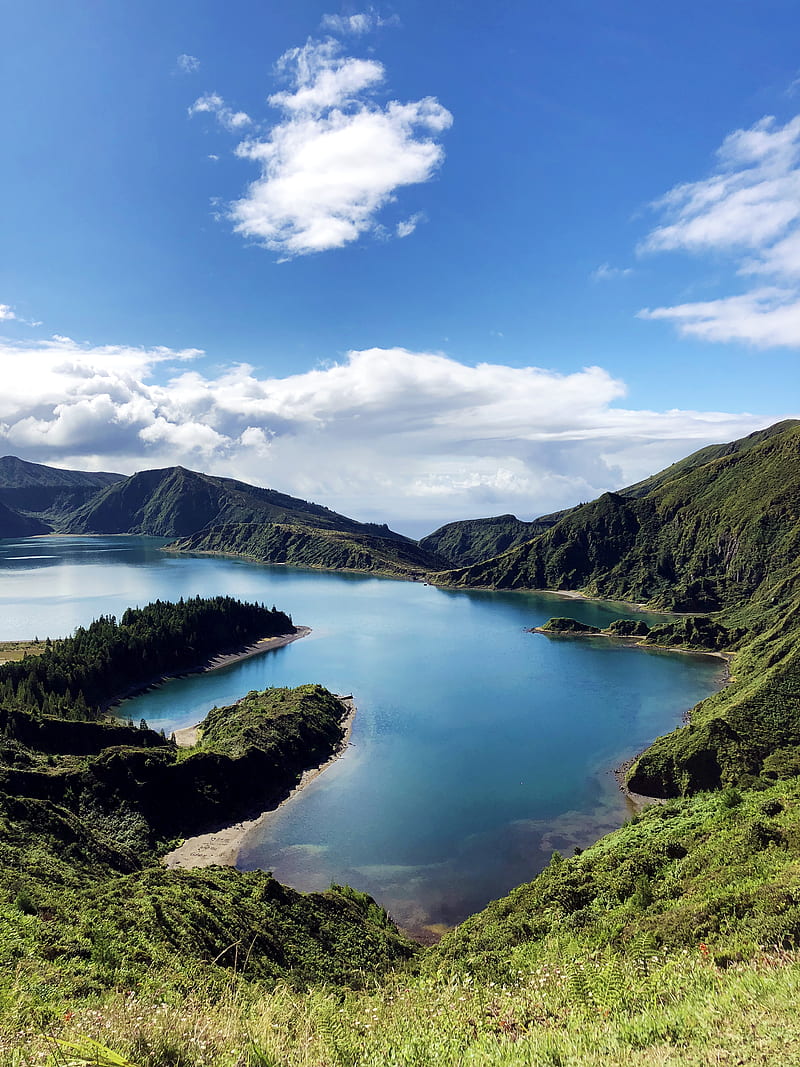 Lake In The Middle Of Mountains Under Blue Sky Hd Phone Wallpaper Peakpx