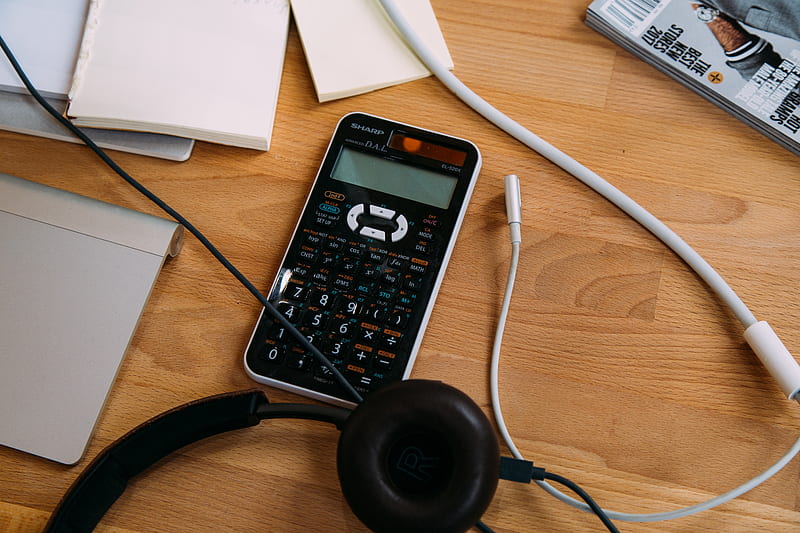 black scientific calculator beside black headphones, HD wallpaper