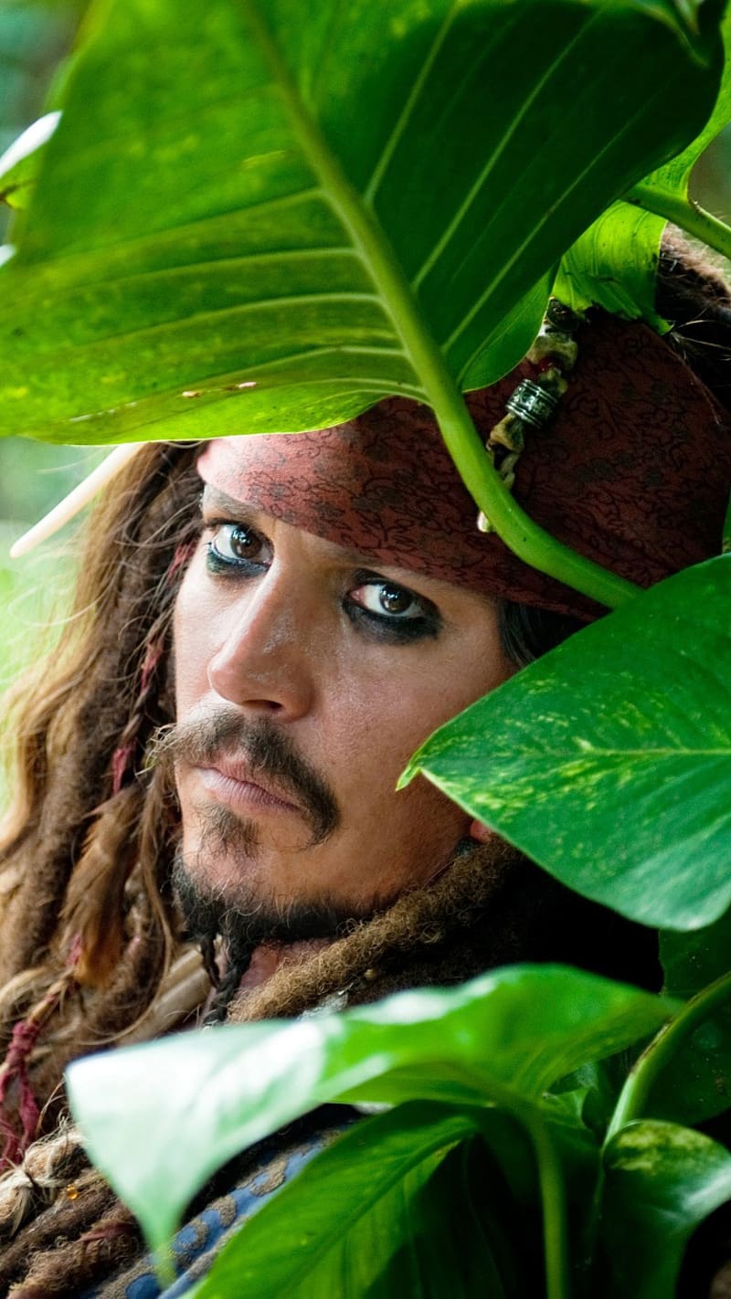 Jack Sparrow Potrait, jack sparrow, potrait, face closeup, leaves, pirate, johny depp, actor, HD phone wallpaper