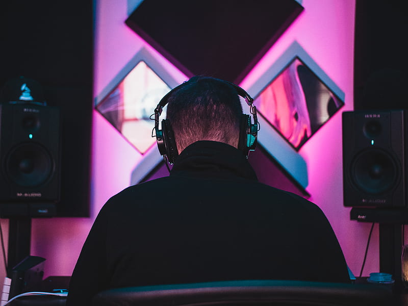 man wearing black headphones near two PA speakers, HD wallpaper