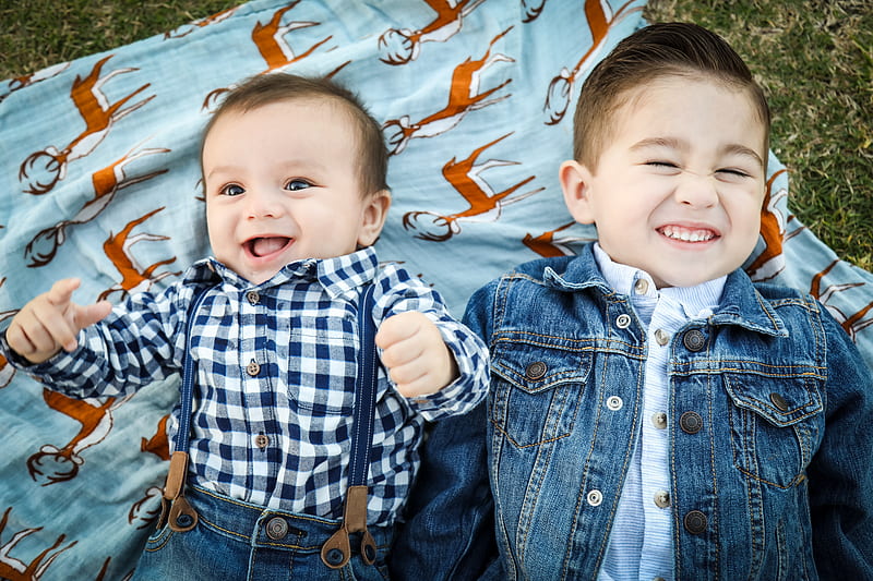two boys laying on blue textile, HD wallpaper