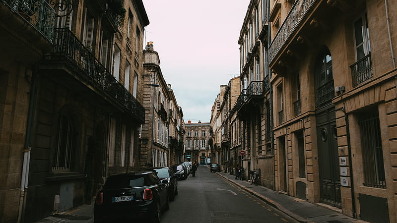 cars parked on the side of the road in between buildings, HD wallpaper