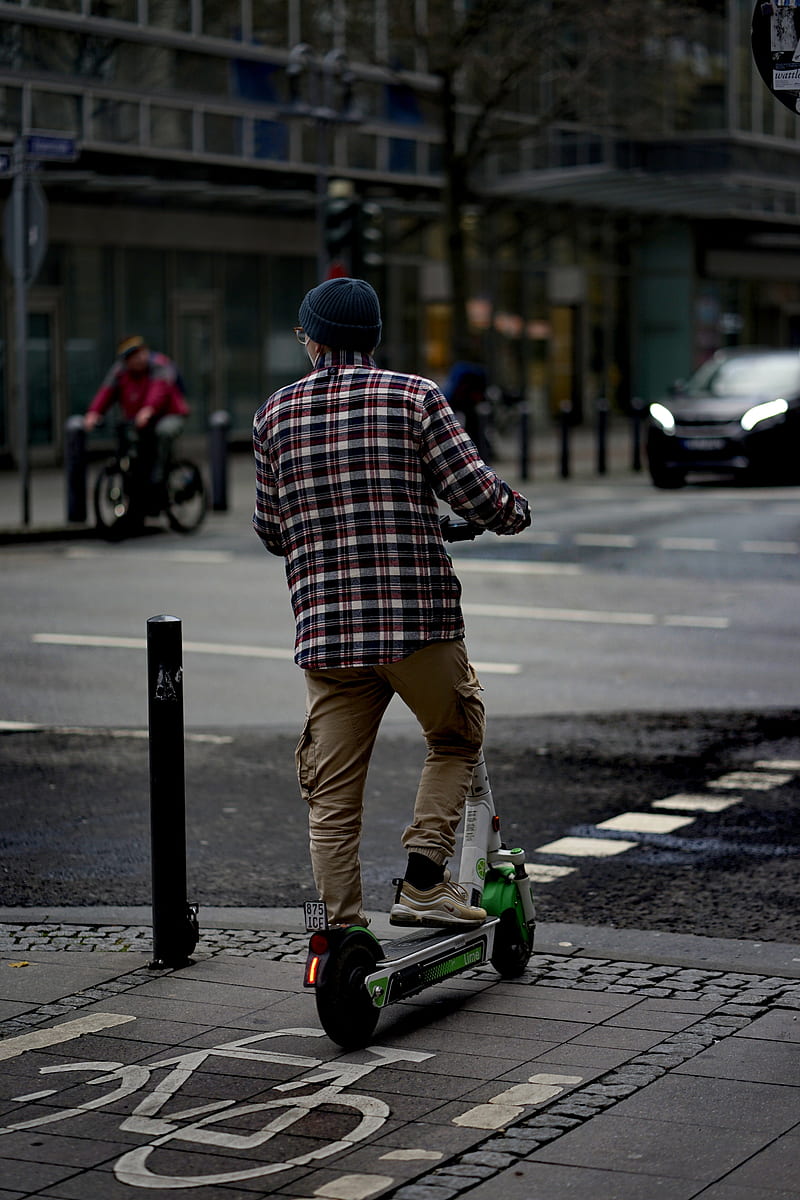 man in red and white plaid dress shirt and brown pants riding green and black skateboard, HD phone wallpaper