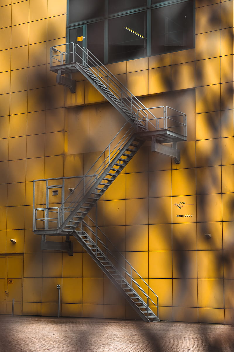 gray steel ladder beside yellow building, HD phone wallpaper