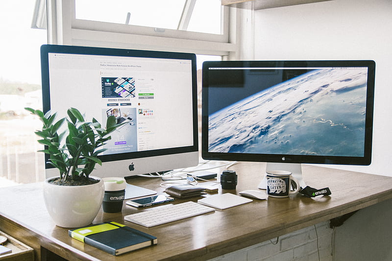 A dual monitor setup on a brown desk., HD wallpaper