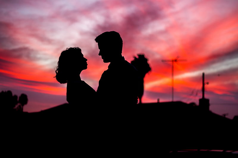 silhouette of man and woman facing each other during golden hour, HD wallpaper