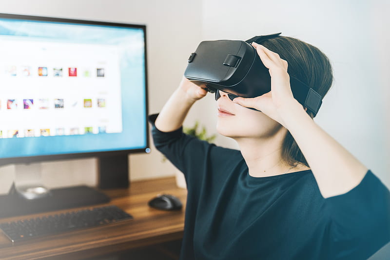 woman using black VR headset beside computer, HD wallpaper