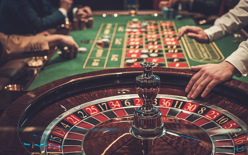 Premium Photo | Close up of bright multicolored casino roulette table with  poker chips ai