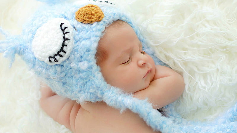 Cute Newborn Baby Is Sleeping On White Woolen Bed Wearing Knitted Woolen Blue Cap Cute, HD wallpaper
