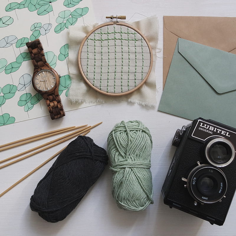 green and black yarns with round brown watch and black Lubitel camera, HD phone wallpaper
