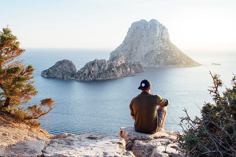 Rear View of Man Sitting on Rock by Sea, HD wallpaper