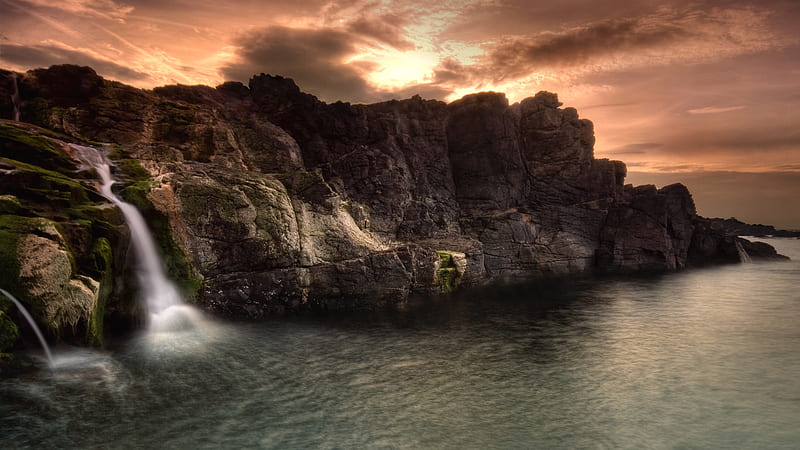 Waterfall into the Sea , rocky beach, sundown, cliff lined coast, waterfall, waterfall into sea, wds, sea, HD wallpaper