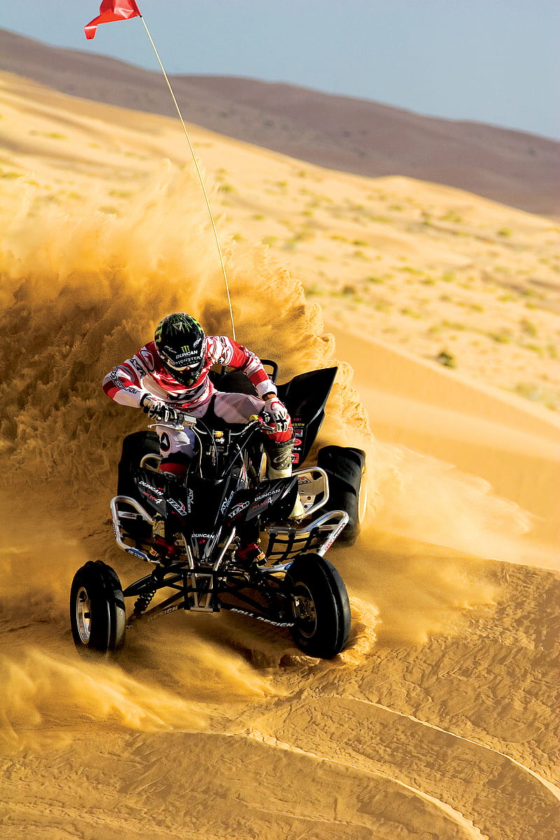 person riding on ATV and drift on sand, HD phone wallpaper