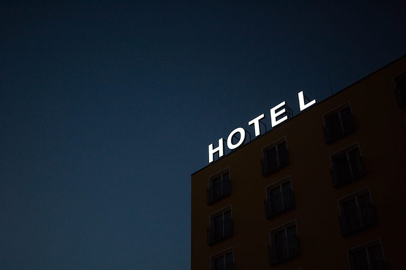 low-angle of Hotel lighted signage on top of brown building during nighttime, HD wallpaper