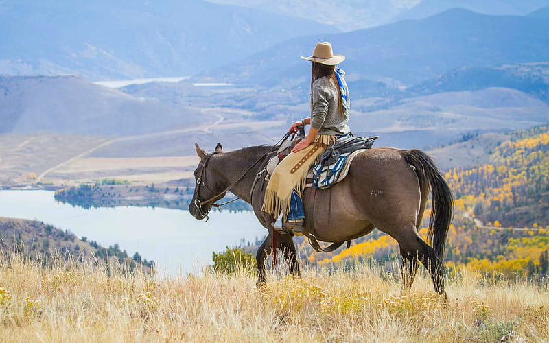 Cowgirl in the Rockies, hills, cowgirl, chaps, saddle, horse, Rockies, lake, hat, water, mountains, HD wallpaper