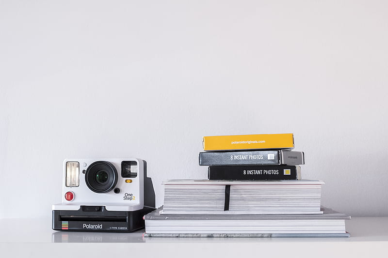 white and black Polaroid instant camera beside book, HD wallpaper