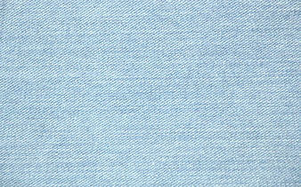Jeans background. Light blue denim fabric texture close up. Stock