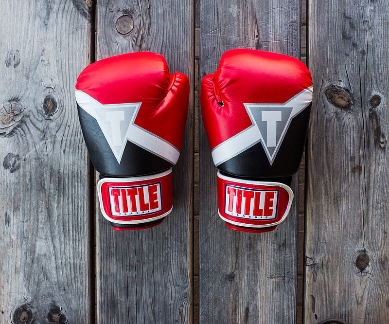 pair of red-and-black Title training gloves on grey wooden plank, HD wallpaper