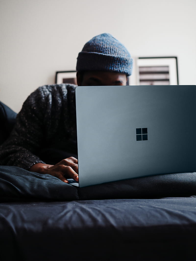 person in gray knit cap using microsoft surface computer in cobalt blue colour, HD phone wallpaper