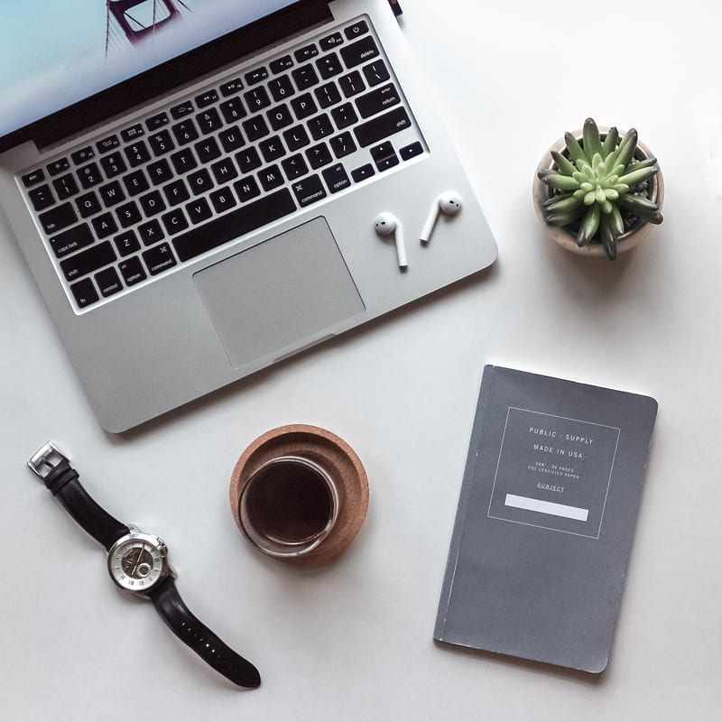 flat-lay graphy of MacBook, coffee-filled cup, book, and wristwatch, HD phone wallpaper