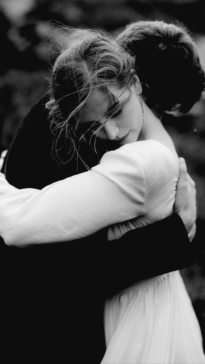 girl hugging boy tightly