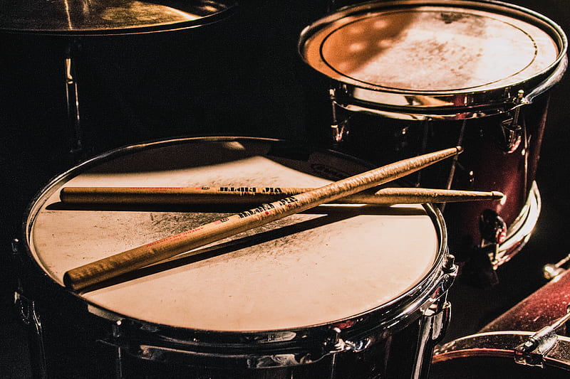 pair of brown wooden drumsticks on top of white and gray musical drum, HD wallpaper