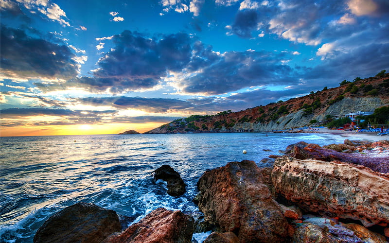 Sunset In Ibiza, rocks, sun, sunbeams, bonito, sunset, clouds, sea, ibiza, spain, beach, splendor, beauty, sunrise, reflection, blue, amazing, lovely, view, ocean, sunlight, waves, ocean waves, sky, sunrays, rays, peaceful, nature, coast, HD wallpaper