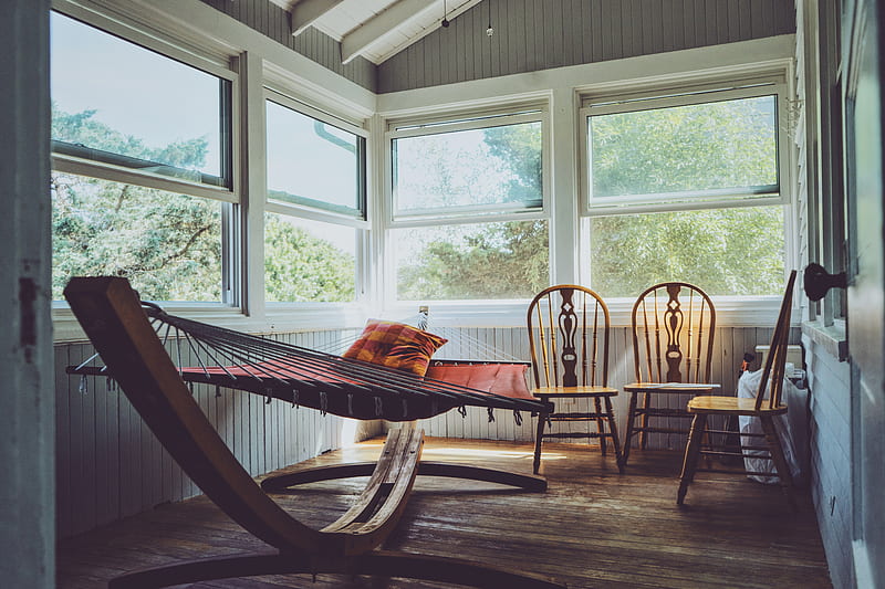 graphy of grey, white, and brown wooden house interior with three brown wooden Windsor chairs beside brown hammock with glass windows, HD wallpaper