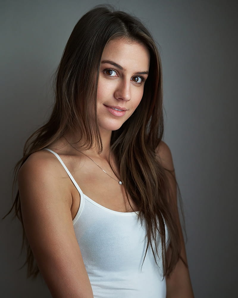 Milan R, women, brunette, long hair, straight hair, brown eyes, looking at viewer, smiling, portrait, tank top, white clothing, jewelry, necklace, simple background, HD phone wallpaper