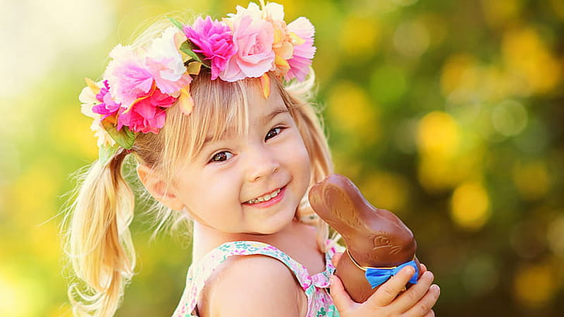 Smiley Girl Kid With Brown Wooden Rabbit Toy Is Wearing Colorful Dress Standing In Blur Bokeh Background Cute, HD wallpaper