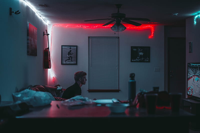 man sitting inside room near window blinds with lights turned on, HD wallpaper