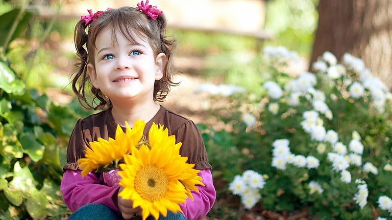 Smiley Cute Little Girl Is Having Sunflowers In Hand Wearing Brown Pink Dress In Flowers Background Cute, HD wallpaper