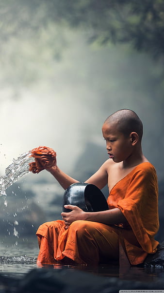 A monk standing meditation. Wall Mural | Buy online at Abposters.com