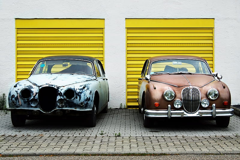 two cars in front of shutter doors, HD wallpaper
