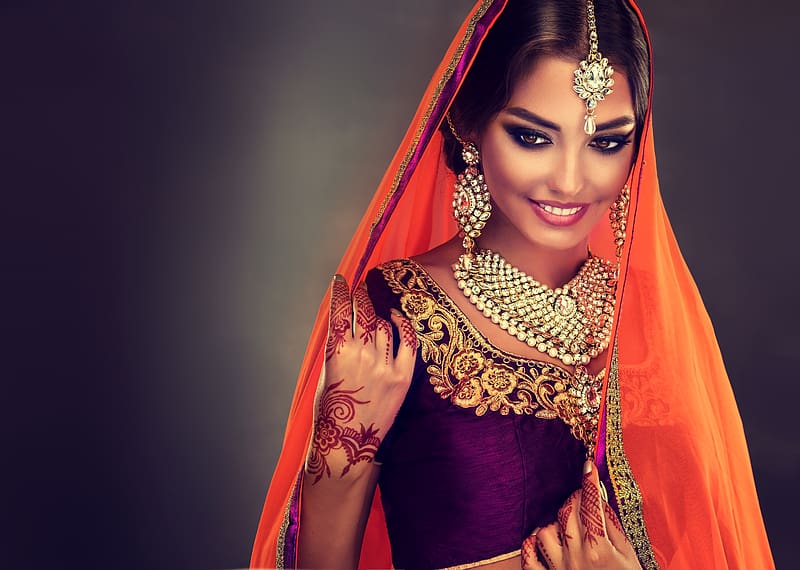 Free Photos - A Beautiful Indian Woman Is Wearing Traditional Garb,  Possibly A Sari, And Jewelry, Including Large Earrings. She Dons A  Seductive Look As She Poses For The Picture, Making It