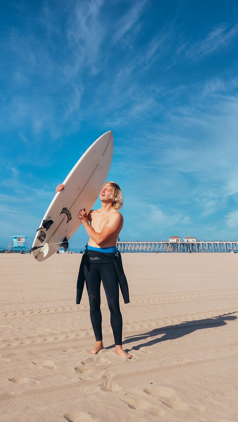 Man in Blue Shorts Holding White Surfboard, HD phone wallpaper