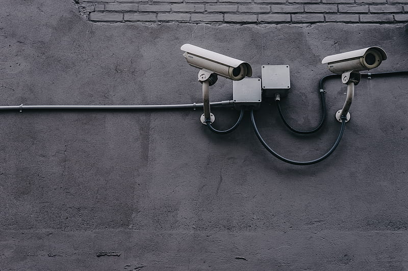 two bullet surveillance cameras attached on wall, HD wallpaper