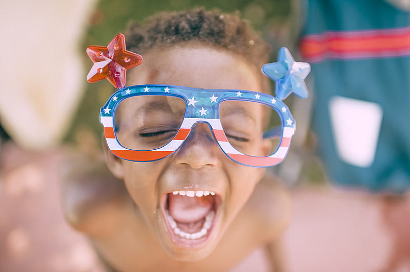 boy wearing American flag print eyeglasses sticking his mouth open, HD wallpaper