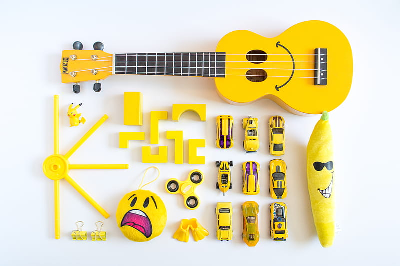 yellow ukulele, cars, emoji plush toy on white surface, HD wallpaper