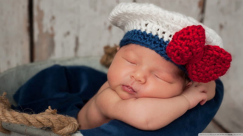 Cute New Born Baby Is Sleeping Dark Blue Satin Towel Wearing Woolen Knitted White Red Cap Cute, HD wallpaper