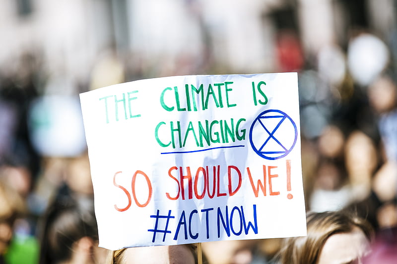 person holding The Climate is Changing signage, HD wallpaper