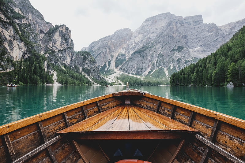 brown wooden boat moving towards the mountain, HD wallpaper