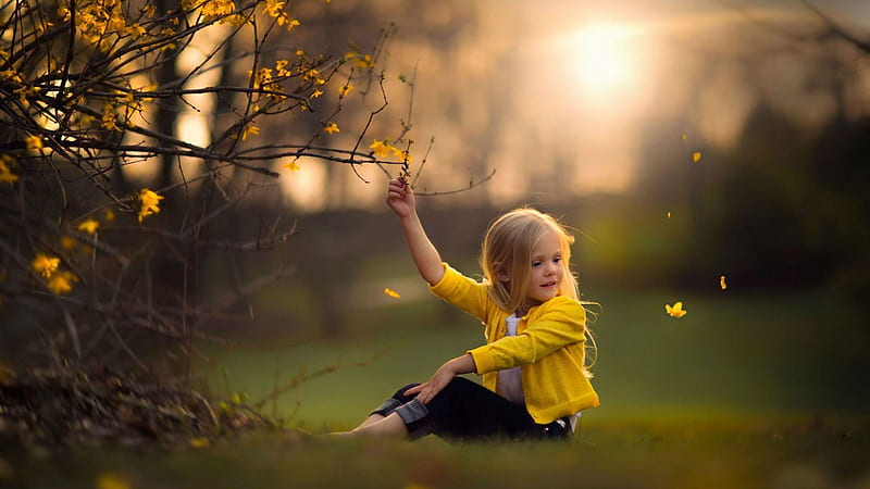 cute baby girl is sitting on green grass touching flower wearing yellow dress with sunlight background cute, HD wallpaper