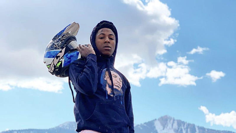 NBA Youngboy Is Wearing Blue Head Covered T-Shirt And Having Helmet In Hand Under Cloudy Blue Sky NBA Youngboy, HD wallpaper