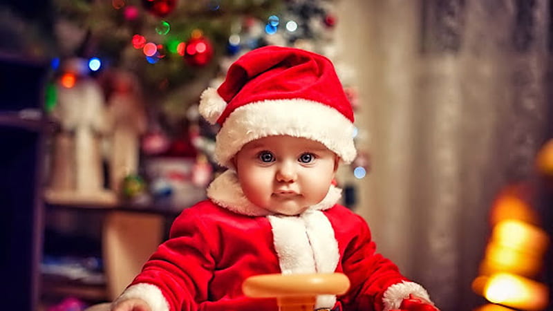 Closeup View Of Cute Child Baby Is Wearing Santa Claus Dress Sitting In Blur Colorful Lights Background Cute, HD wallpaper