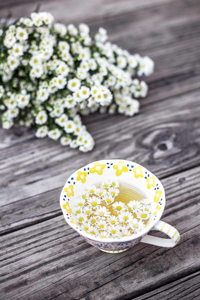 white and yellow cup with flowers on table, HD phone wallpaper