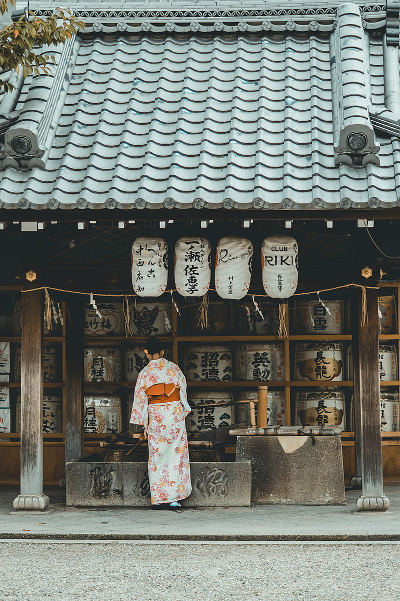 woman wearing orange and white kimono dress standing near the house, HD phone wallpaper