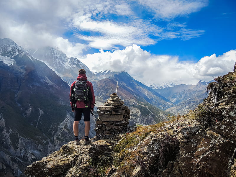 man standing on top of mountain beside cairn stones, HD wallpaper