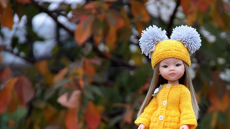 Cute Baby Doll Is Wearing Yellow Woolen Knitted Dress And Cap In Blur  Autumn Background Doll, HD wallpaper | Peakpx