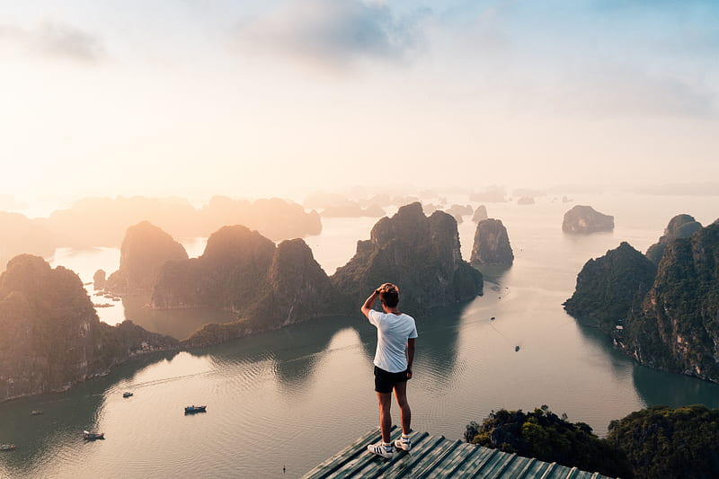 man standing on hill overlooking islands, HD wallpaper